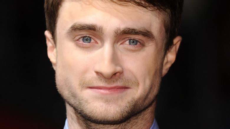 Daniel Radcliffe smiling for a photo