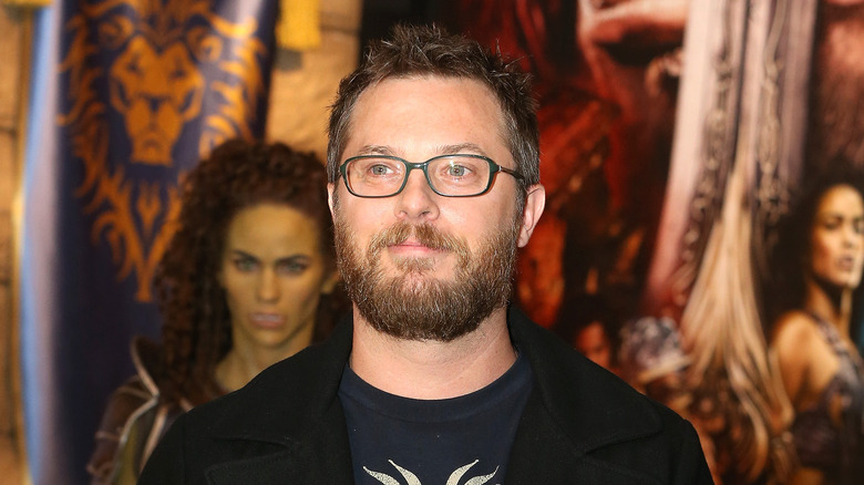 Duncan Jones wearing black jacket