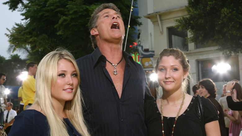 David Hasselhoff and his daughters posing on the red carpet