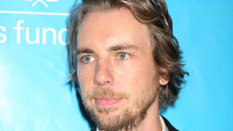 Dax Shepard looking off to the side 