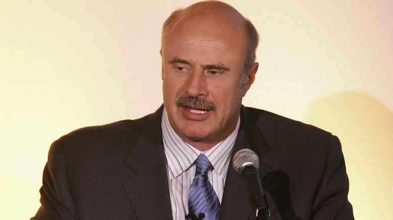 Dr. Phil standing on stage