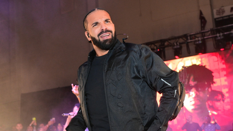 Drake onstage during a show