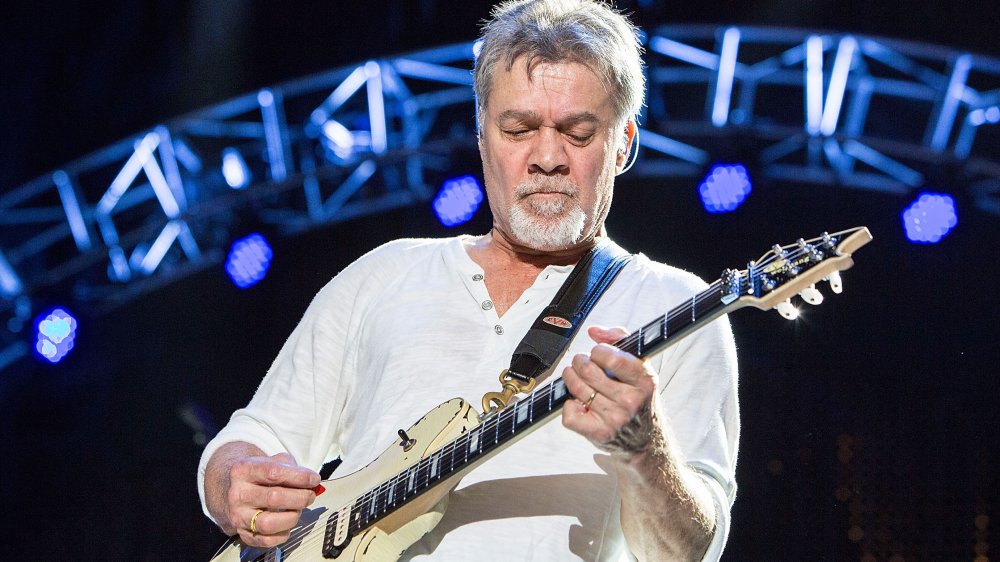 Eddie Van Halen playing on stage in 2015