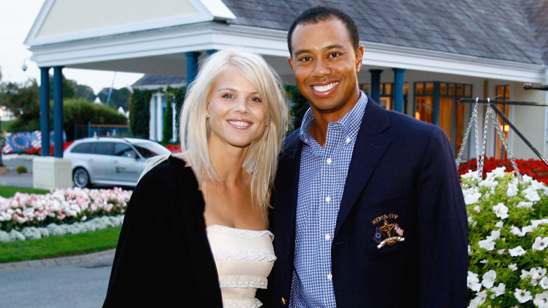 Elin Nordegren and Tiger Woods pose for a photo