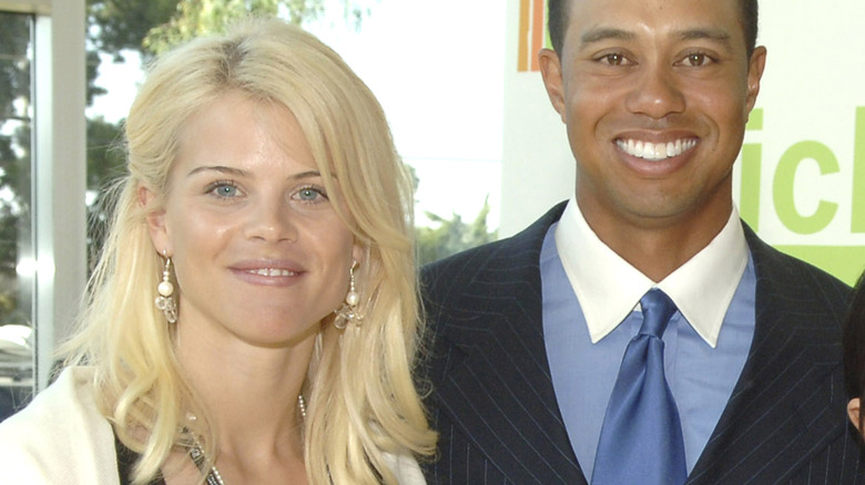 Elin Nordegren and Tiger Woods smile for a photo