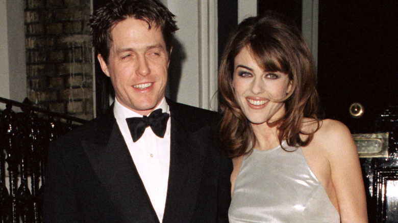 Elizabeth Hurley, Hugh Grant smiling 90s