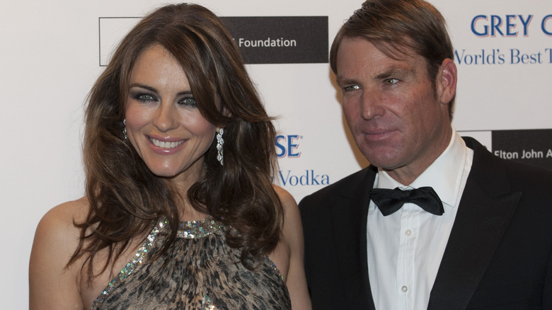 Elizabeth Hurley, Shane Warne smiling 