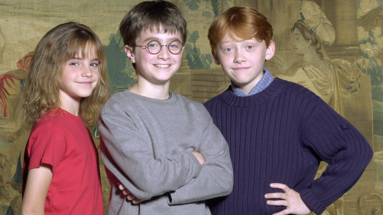 Emma Watson, Daniel Radcliffe, and Rupert Grint smiling