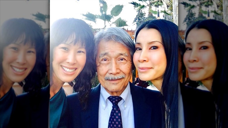 Lisa Ling poses with her father and sister