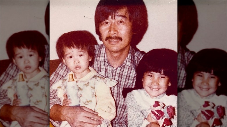 Young Lisa Ling poses with her father and sister