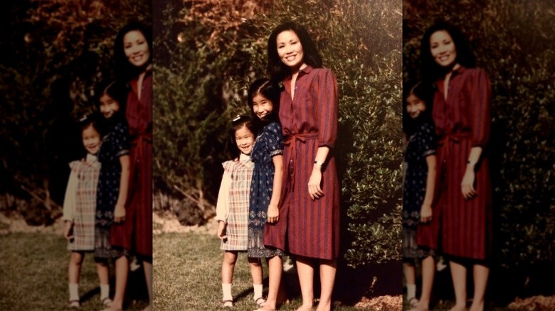 Young Lisa Ling poses with her mother and sister