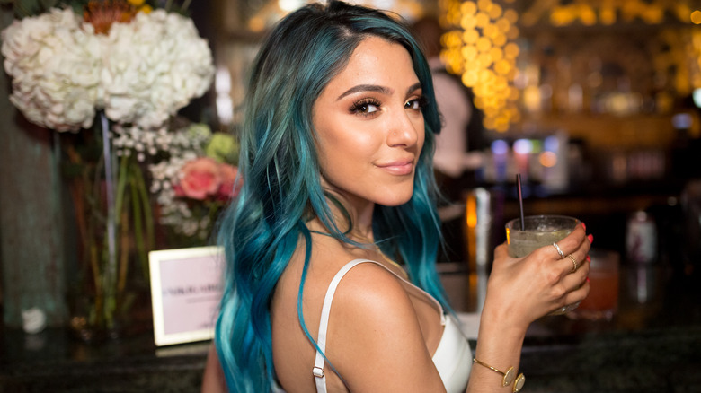 Niki DeMartino holding a drink