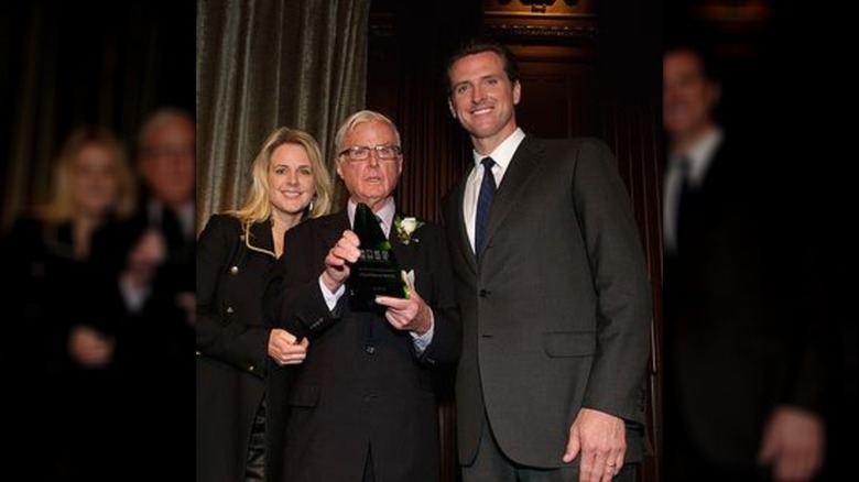 Gavin Newsom poses with his sister and father