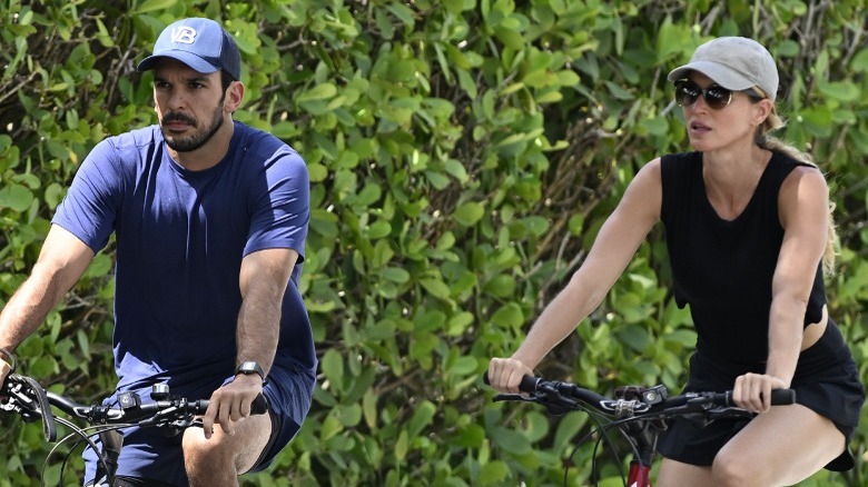 Gisele Bündchen and Joaquim Valente riding bikes