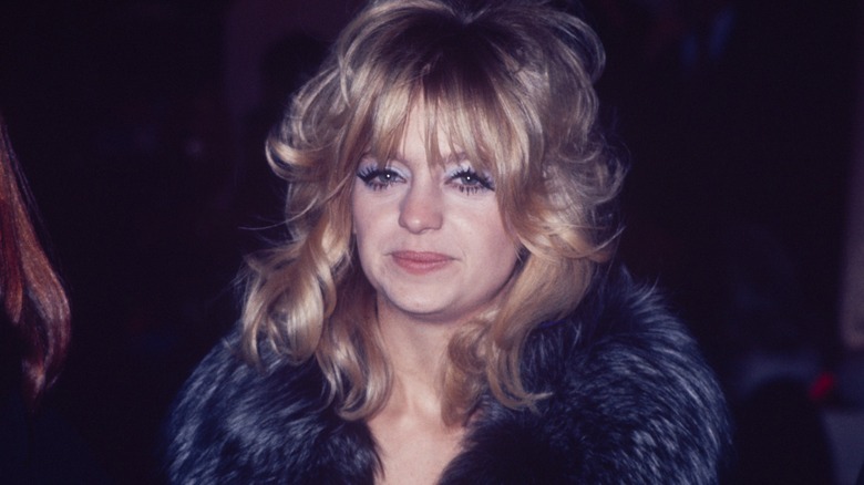 Goldie Hawn wears a fur coat