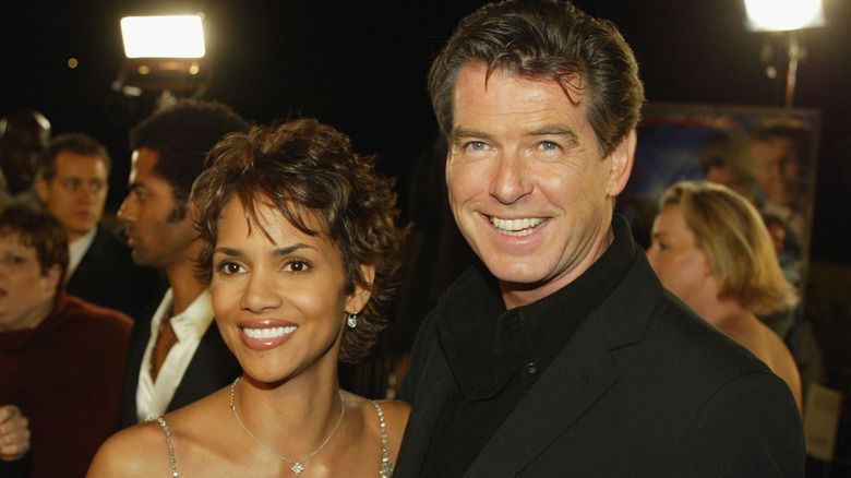 Halle Berry with Pierce Brosnan, both smiling