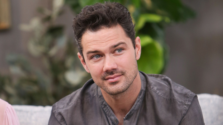 Ryan Paevey wearing gray shirt