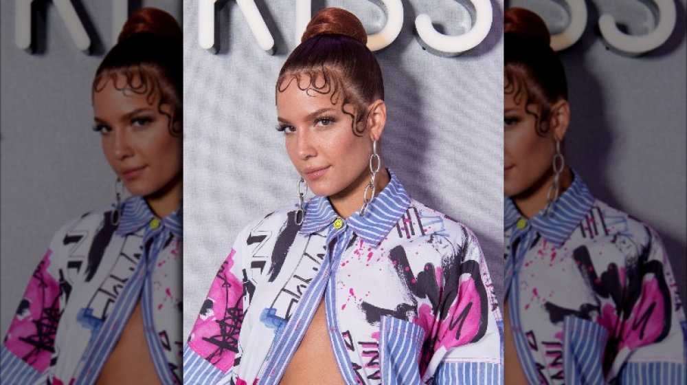 Halsey in a colorful jacket and hair in bun