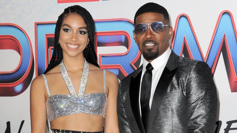 Corinne and Jamie Foxx posing on a red carpet