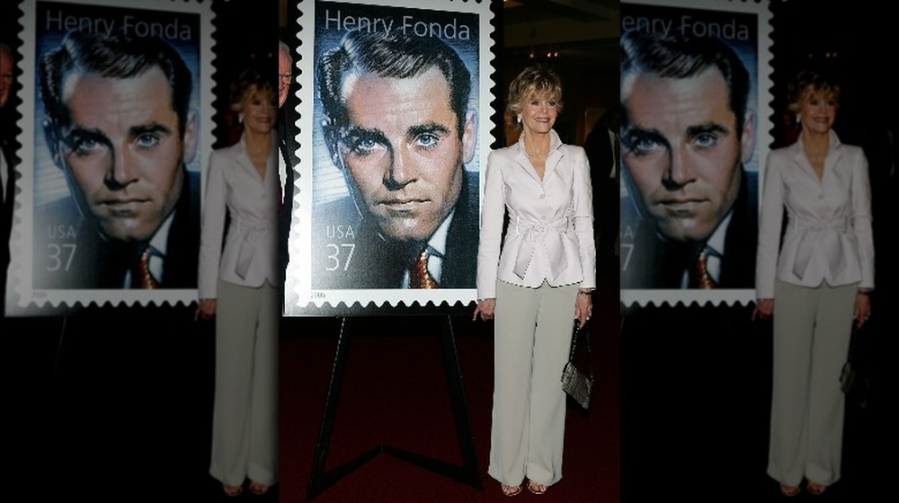 Jane Fonda in front of Henry Fonda postage stamp