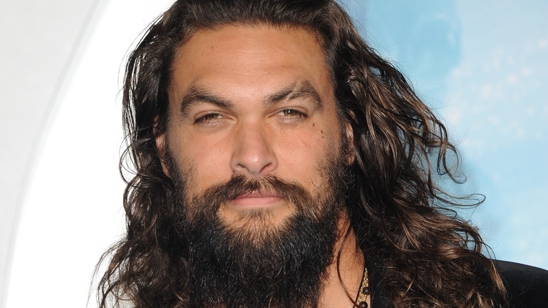 Jason Momoa, serious, on the red carpet 