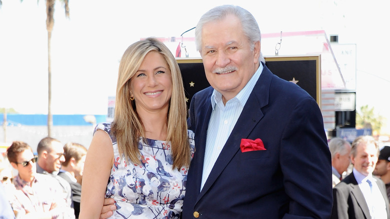 Jennifer Aniston and father John Aniston smiling and posing