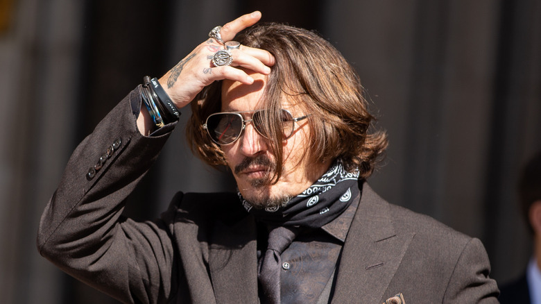 Johnny Depp fixing hair