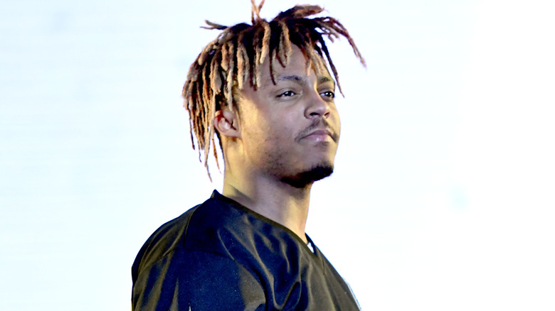 Juice WRLD squinting on stage