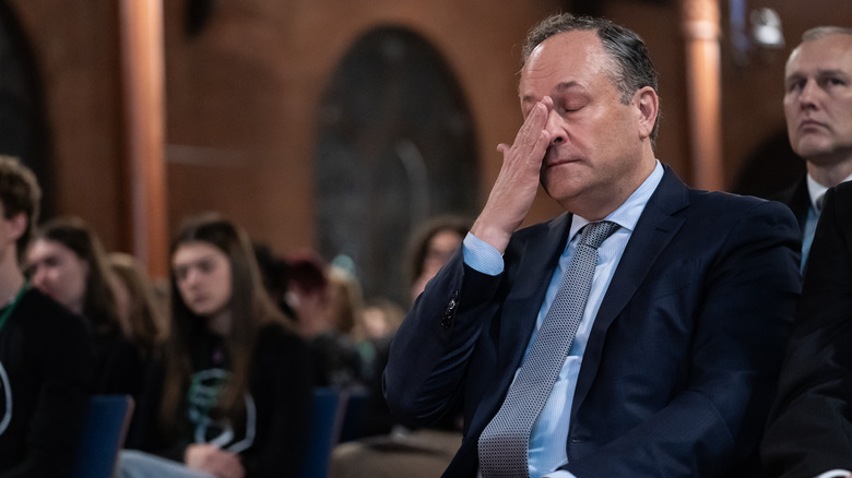 Second Gentleman Doug Emhoff, husband of Vice President Kamala Harris, reacting as gun violence survivors speak during a national vigil