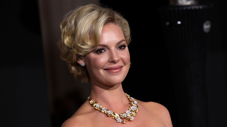 Katherine Heigl wearing an updo hairstyle and large sparkling necklace