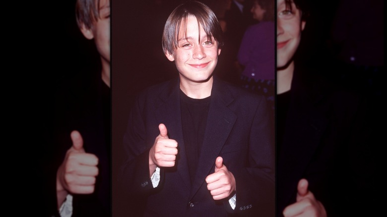 Young Kieran Culkin giving thumbs up