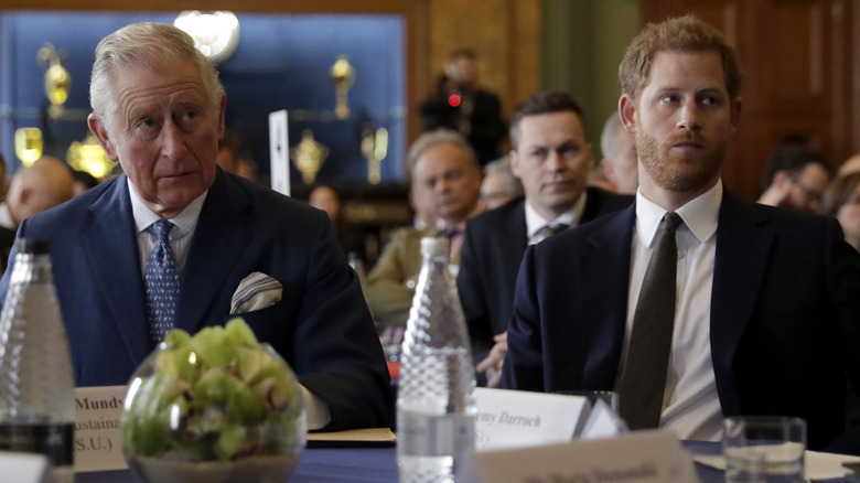 King Charles and Prince Harry look tense