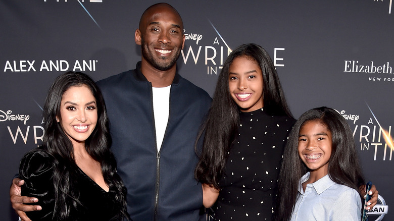 Vanessa, Kobe Bryant, Natalia, and Gianna Bryant on a red carpet