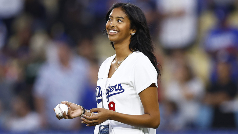 Natalia Bryant holds a baseball