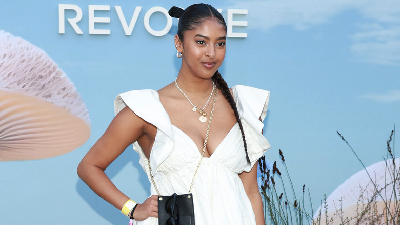 Natalia Bryant wearing white dress on a red carpet