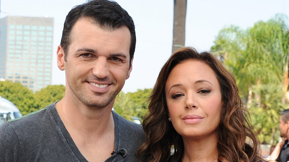 Tony Dovolani and Leah Remini on Extra in 2013