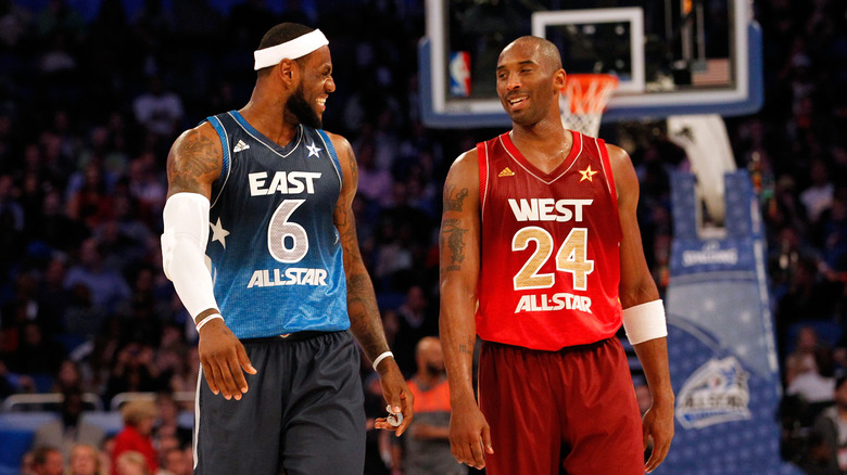 LeBron James and Kobe Bryant laughing together on the court