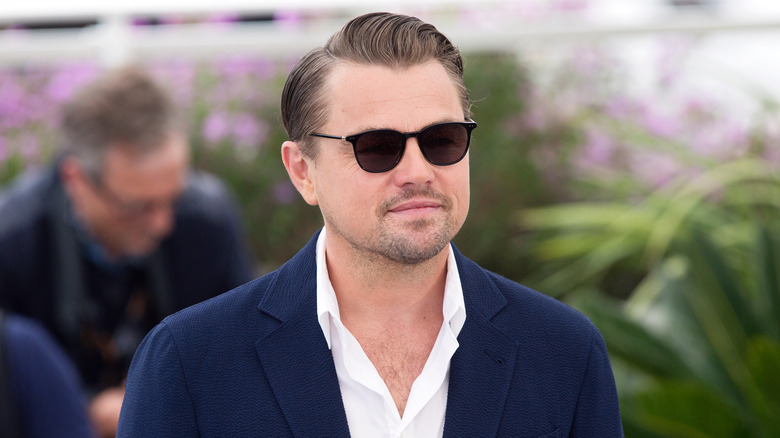 Leonardo Dicaprio smiling, wearing sunglasses