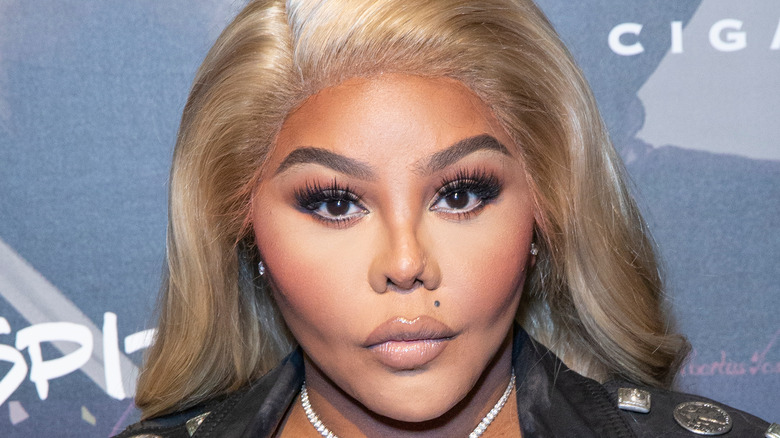 Lil' Kim posing