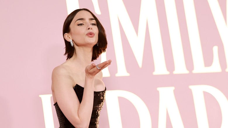 Lily Collins blows kiss