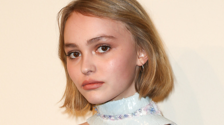 Lily-Rose Depp posing in scarf matching top