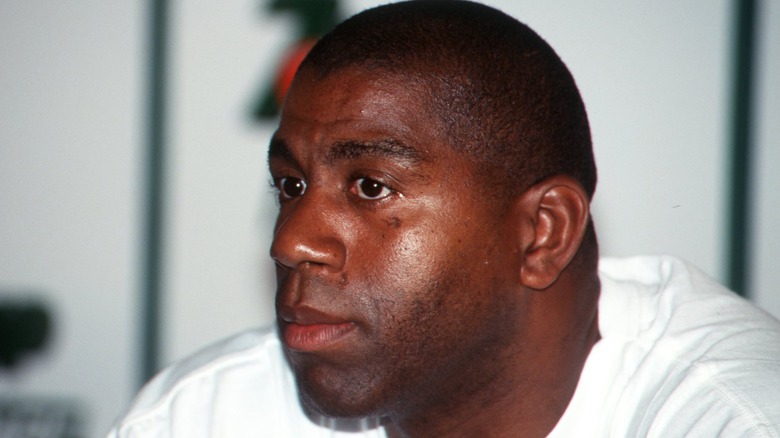 Magic Johnson listening intently