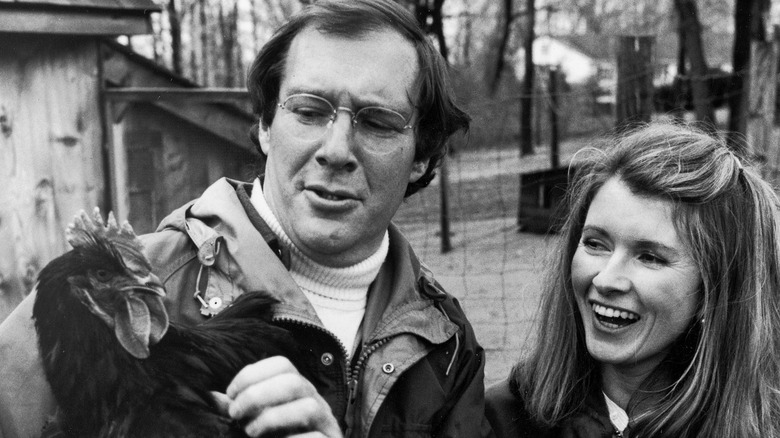 Andrew and Martha Stewart with a chicken