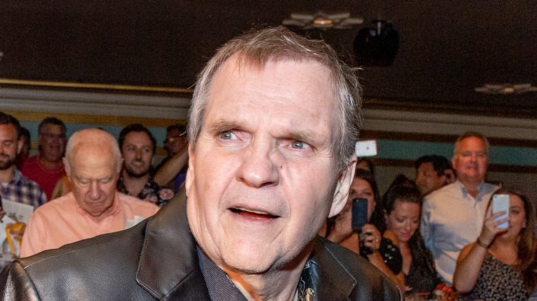 Meat Loaf looking anxious in a crowd