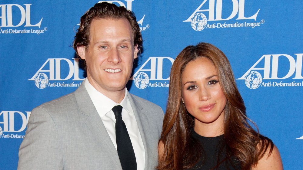 Trevor Engelson and Meghan Markle, smiling