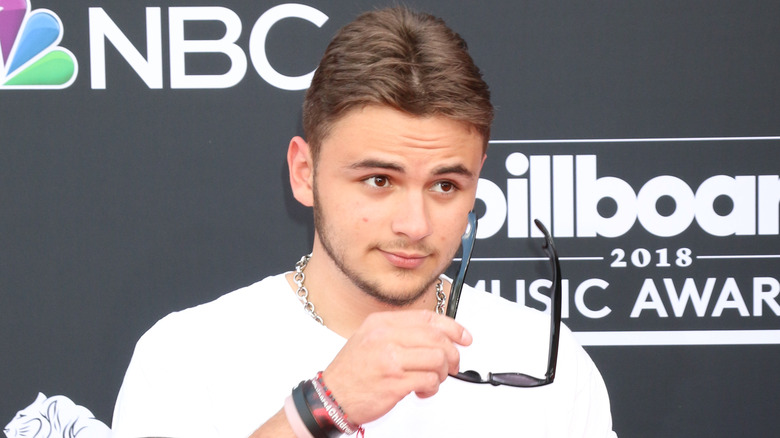 Prince Jackson taking off his glasses