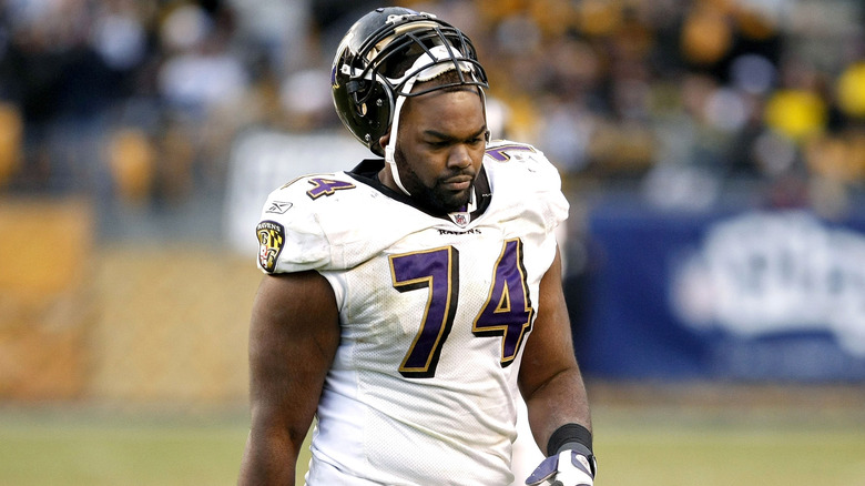 Michael Oher with helmet pushed up