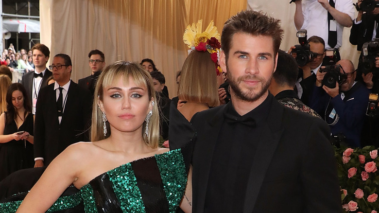 Miley Cyrus and Liam Hemsworth pose together