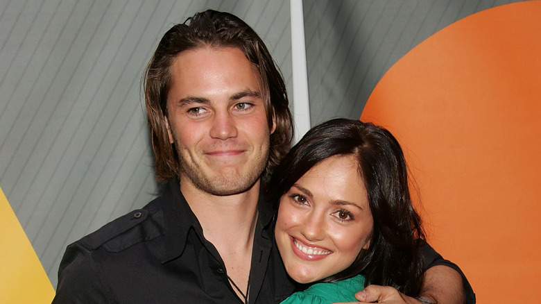 Taylor Kitsch posing with Minka Kelly