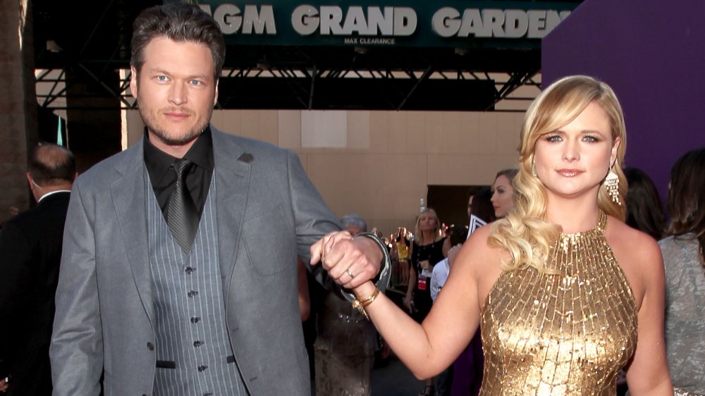 Blake Shelton and Miranda Lambert holding hands